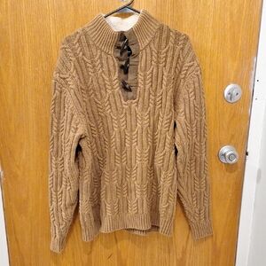 Medium brown cable knit sweater with elbow patches